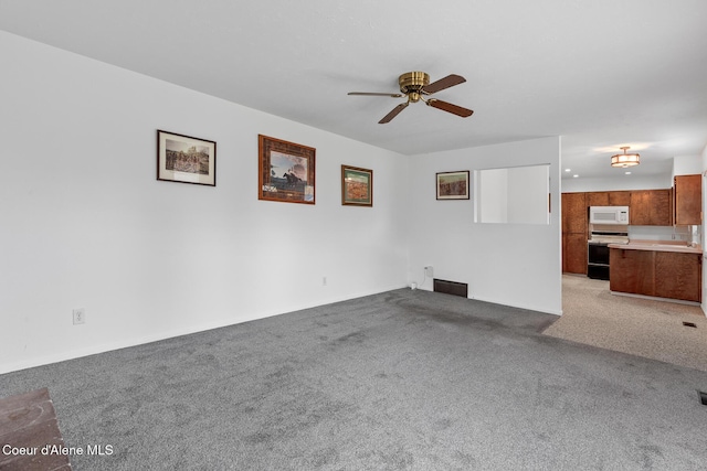 unfurnished living room with light carpet, visible vents, and a ceiling fan