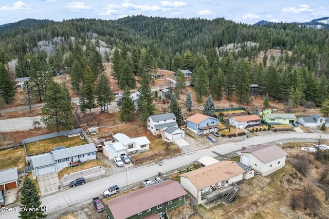 drone / aerial view with a residential view and a view of trees