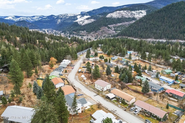 bird's eye view with a mountain view and a view of trees