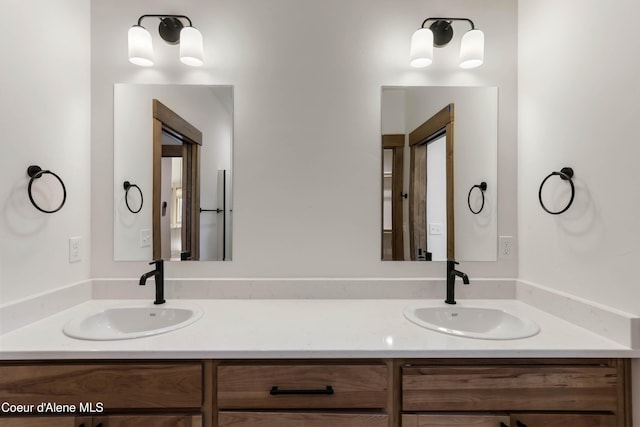 bathroom with a sink and double vanity