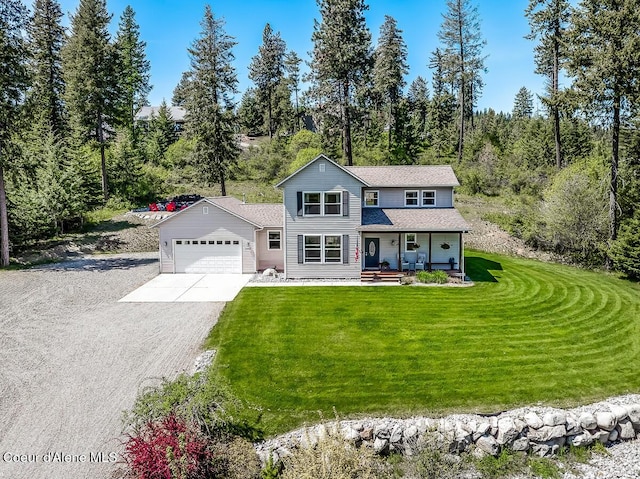 traditional-style home with a garage, a front yard, gravel driveway, and covered porch