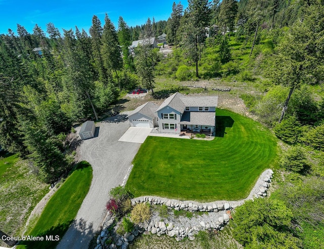 aerial view with a wooded view