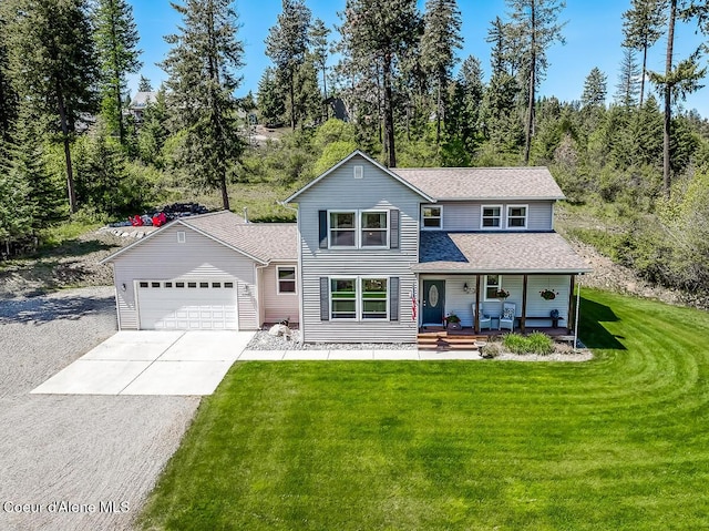 traditional-style home with a porch, a shingled roof, a front yard, a garage, and driveway