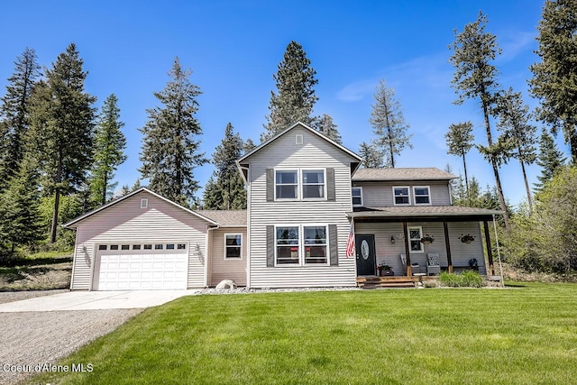 traditional-style home with concrete driveway, a front lawn, a porch, and an attached garage