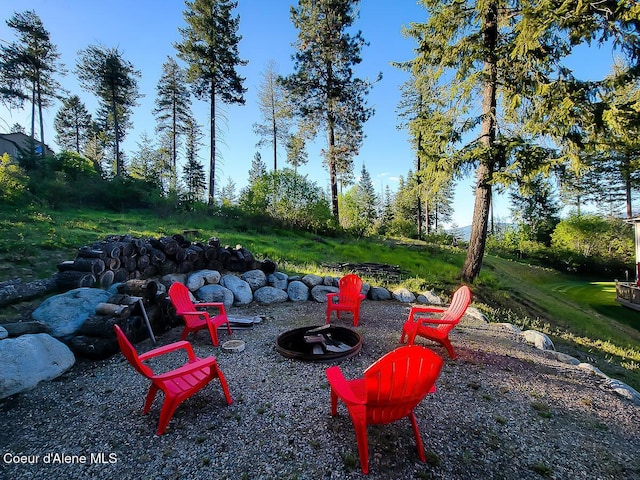 view of yard with a fire pit