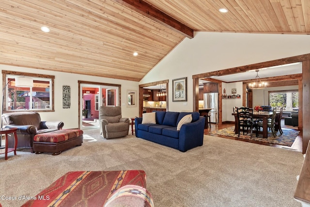 living area featuring high vaulted ceiling, beam ceiling, carpet, and wood ceiling