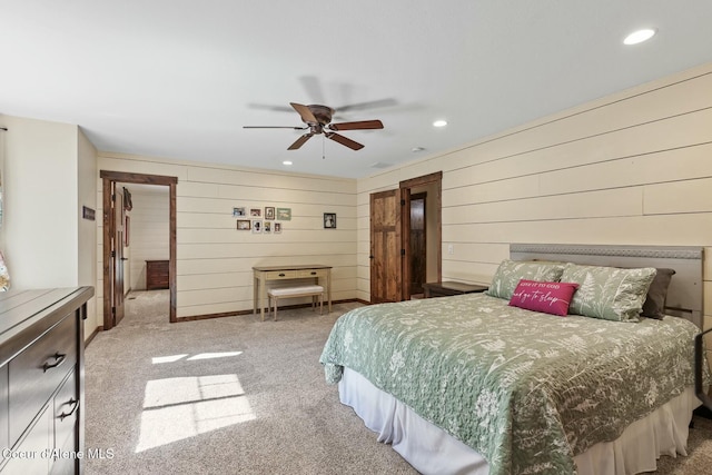 bedroom featuring light carpet, baseboards, and recessed lighting