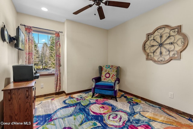 living area with ceiling fan, recessed lighting, and baseboards