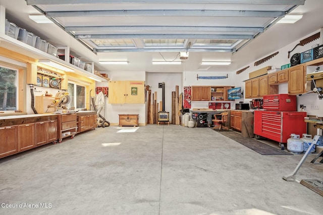 garage with a workshop area and a garage door opener