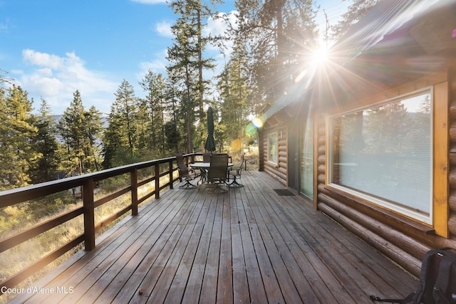 wooden deck featuring outdoor dining space