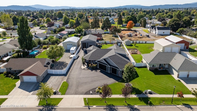 birds eye view of property featuring a residential view and a mountain view