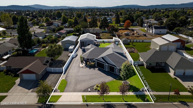 birds eye view of property featuring a mountain view and a residential view