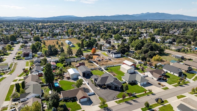 birds eye view of property with a residential view and a mountain view