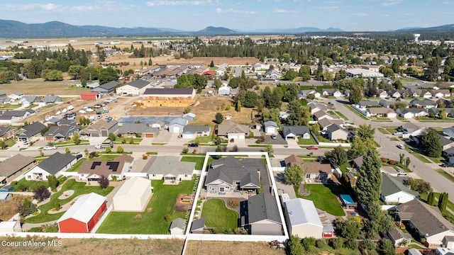 drone / aerial view featuring a mountain view and a residential view