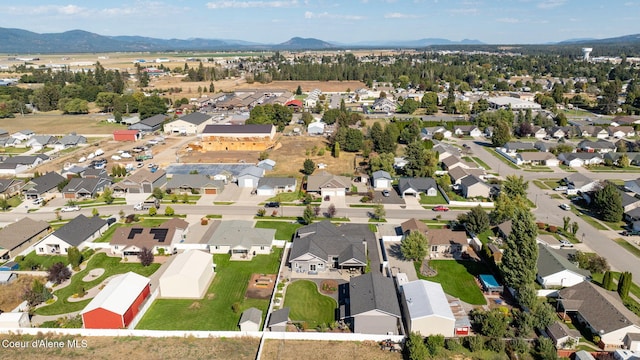 birds eye view of property featuring a mountain view and a residential view