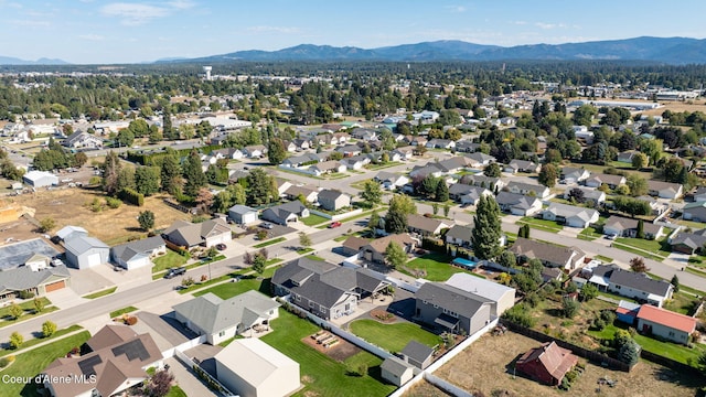 drone / aerial view featuring a mountain view and a residential view