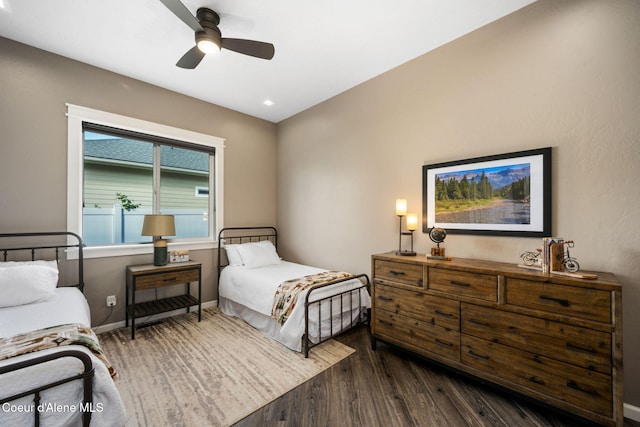 bedroom with dark wood-type flooring, recessed lighting, baseboards, and ceiling fan