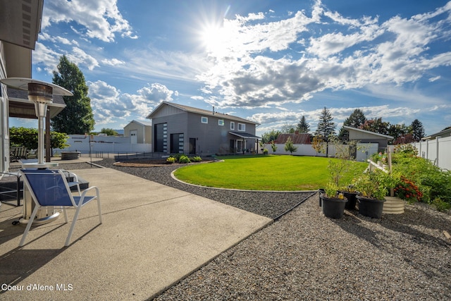 view of yard featuring a patio and a fenced backyard