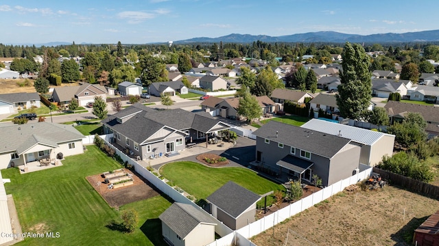 birds eye view of property featuring a mountain view and a residential view