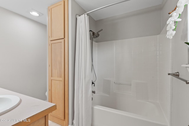 bathroom with shower / tub combo with curtain and vanity