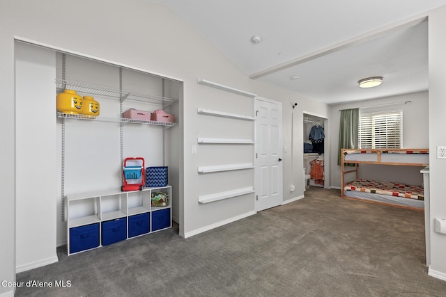 rec room featuring vaulted ceiling, carpet, and baseboards