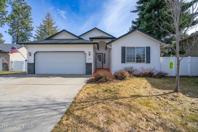 ranch-style house with brick siding, an attached garage, driveway, and fence