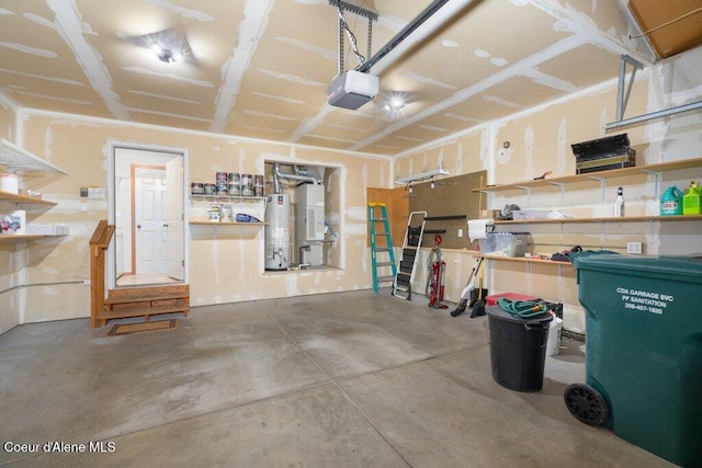 garage featuring water heater and a garage door opener