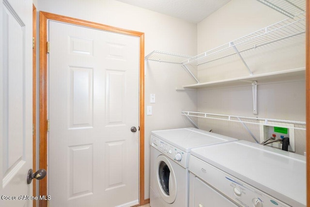 washroom with laundry area and separate washer and dryer