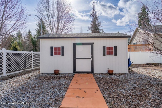 view of shed with fence