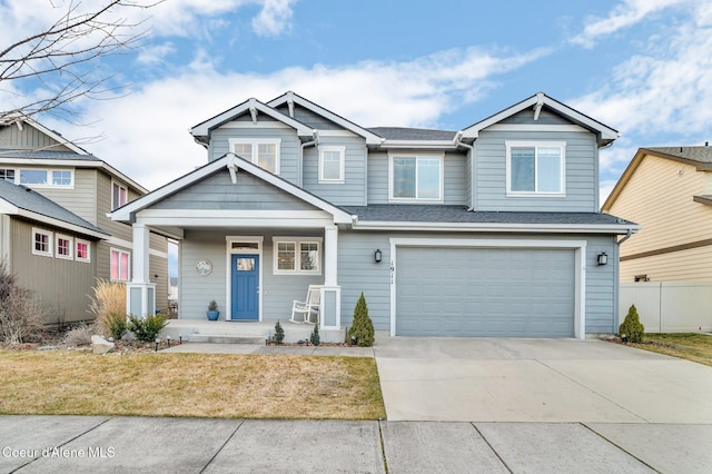 craftsman house featuring fence, a porch, a shingled roof, concrete driveway, and a garage