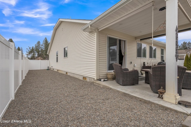 exterior space featuring an outdoor living space and a fenced backyard