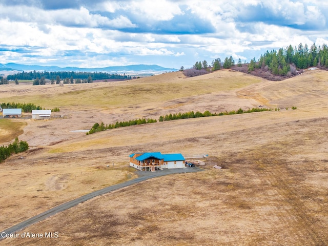 bird's eye view with a rural view and a mountain view