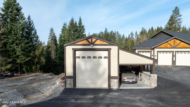 garage featuring aphalt driveway