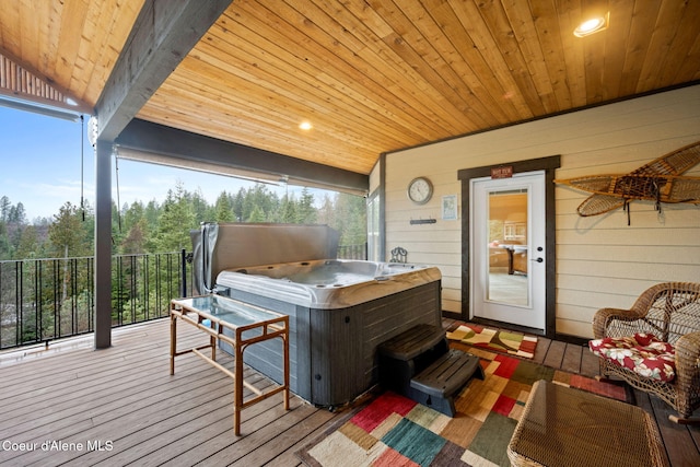 deck featuring a hot tub