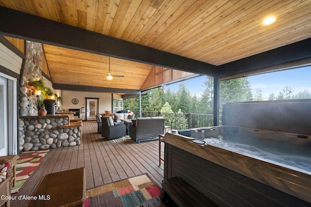 deck with an outdoor hangout area and a hot tub