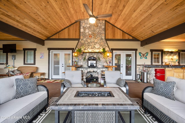 living room featuring french doors, wood ceiling, and a ceiling fan