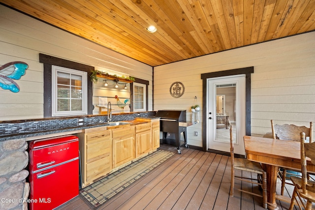 wooden deck featuring a sink and exterior kitchen