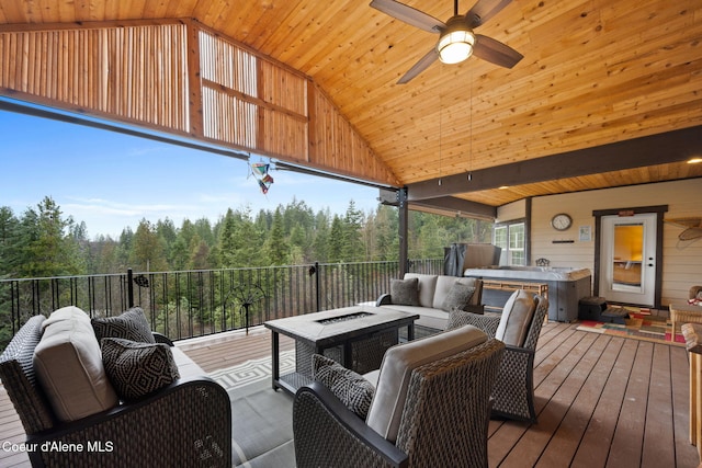 wooden terrace featuring an outdoor living space with a fire pit and ceiling fan