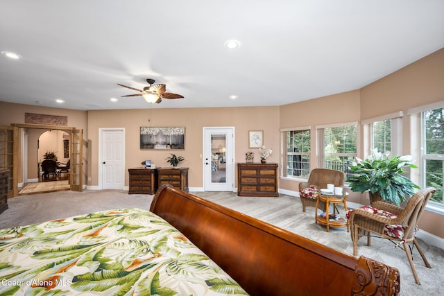 bedroom with recessed lighting, light colored carpet, a ceiling fan, and baseboards