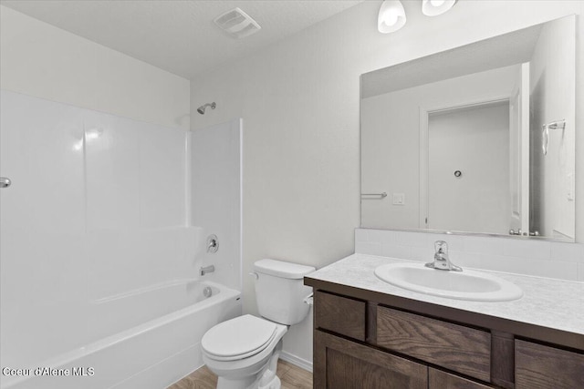 full bath featuring visible vents, toilet, bathtub / shower combination, and vanity