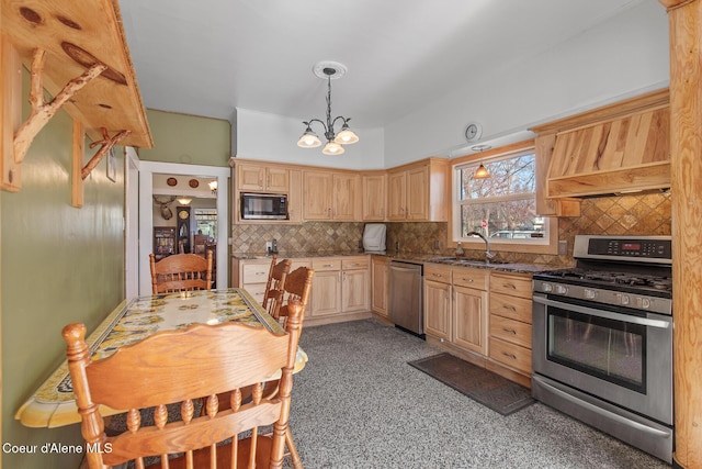 kitchen with light brown cabinets, a sink, tasteful backsplash, appliances with stainless steel finishes, and a chandelier