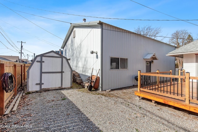 view of shed featuring fence