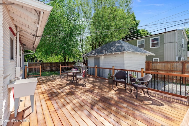 924 E Front Ave, Coeur Dalene, ID 83814 - wooden deck featuring a fenced backyard and outdoor dining area
