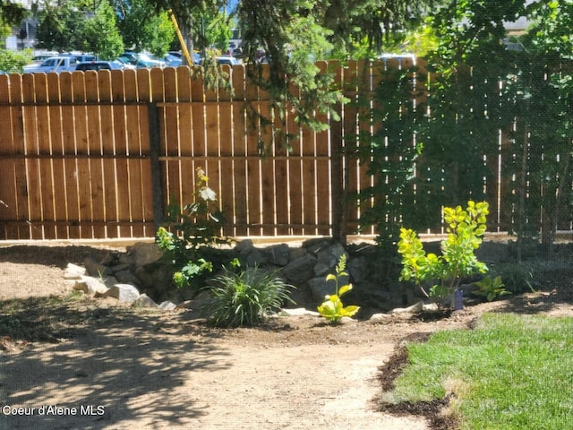 view of gate featuring fence