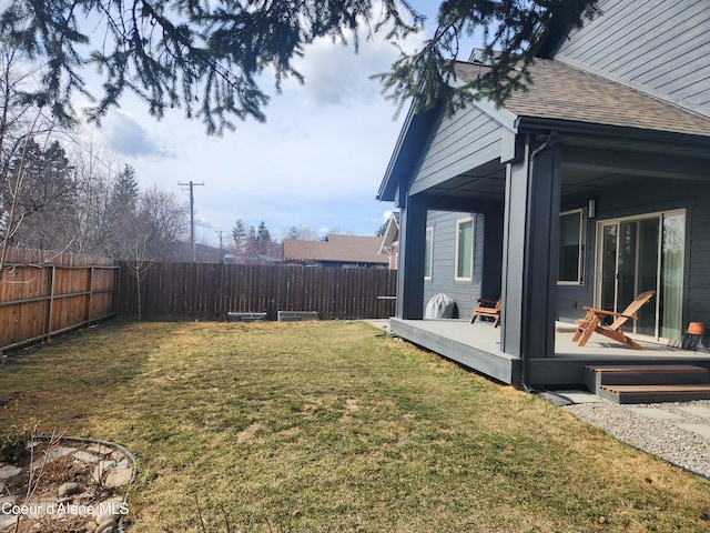 view of yard featuring a wooden deck and a fenced backyard