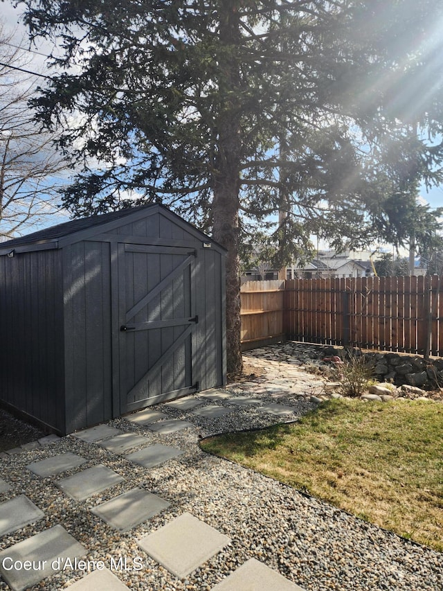 view of shed with fence