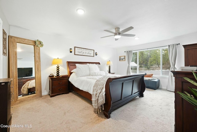 bedroom featuring light carpet, recessed lighting, ceiling fan, and baseboards