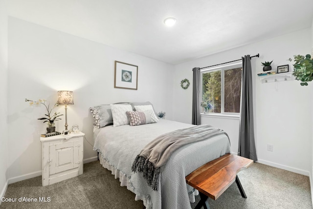 bedroom featuring baseboards and carpet floors