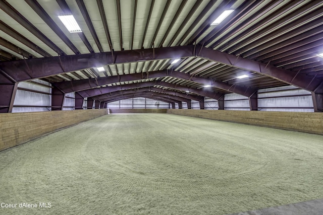 interior space with metal wall and vaulted ceiling