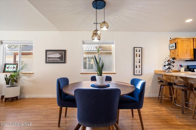 dining space featuring recessed lighting, light wood-type flooring, and baseboards